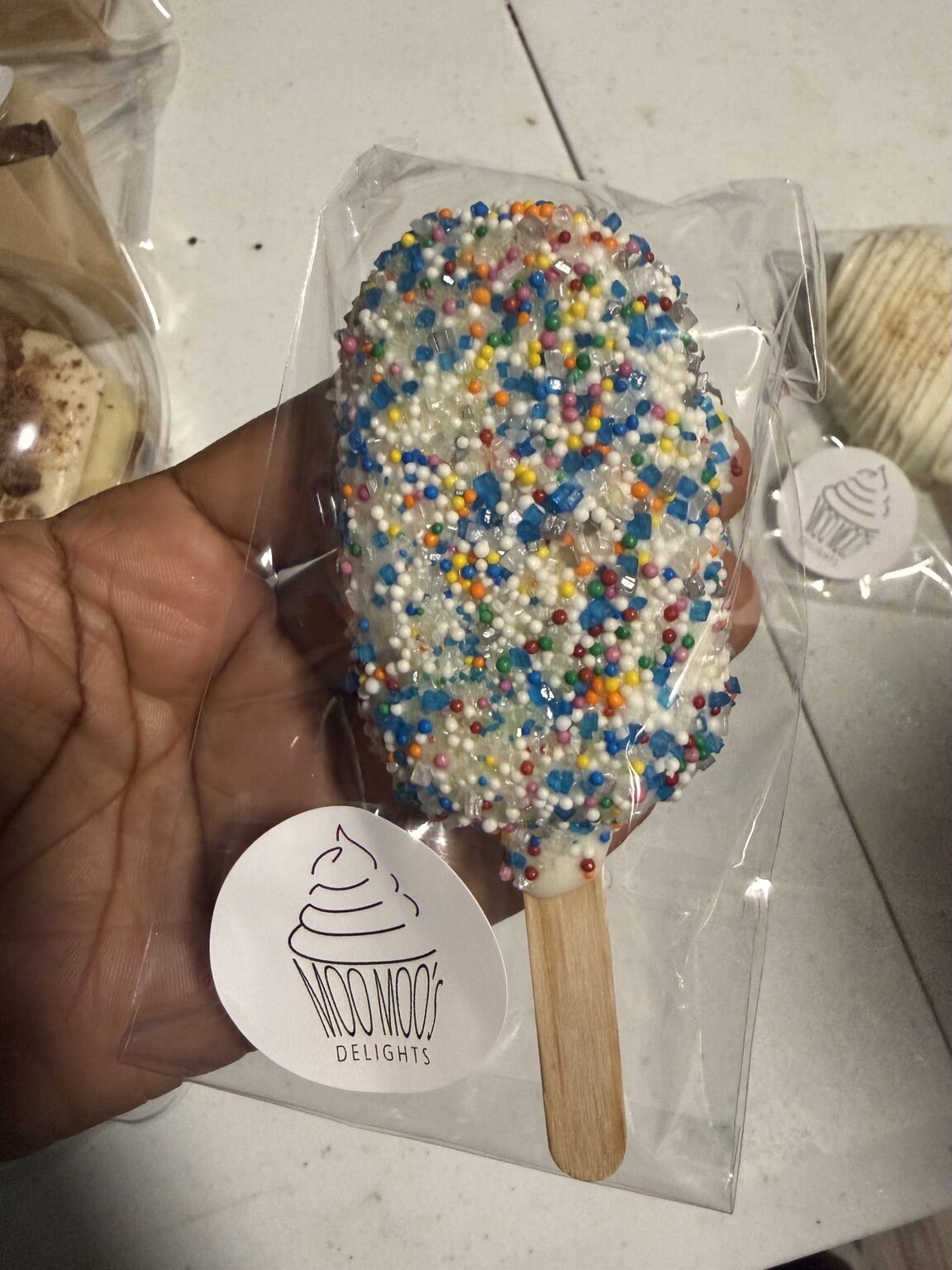 Sprinkle covered cakesicle